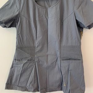 Jaanuu scrub set. Grey. Medium top and bottoms. Used but good condition .